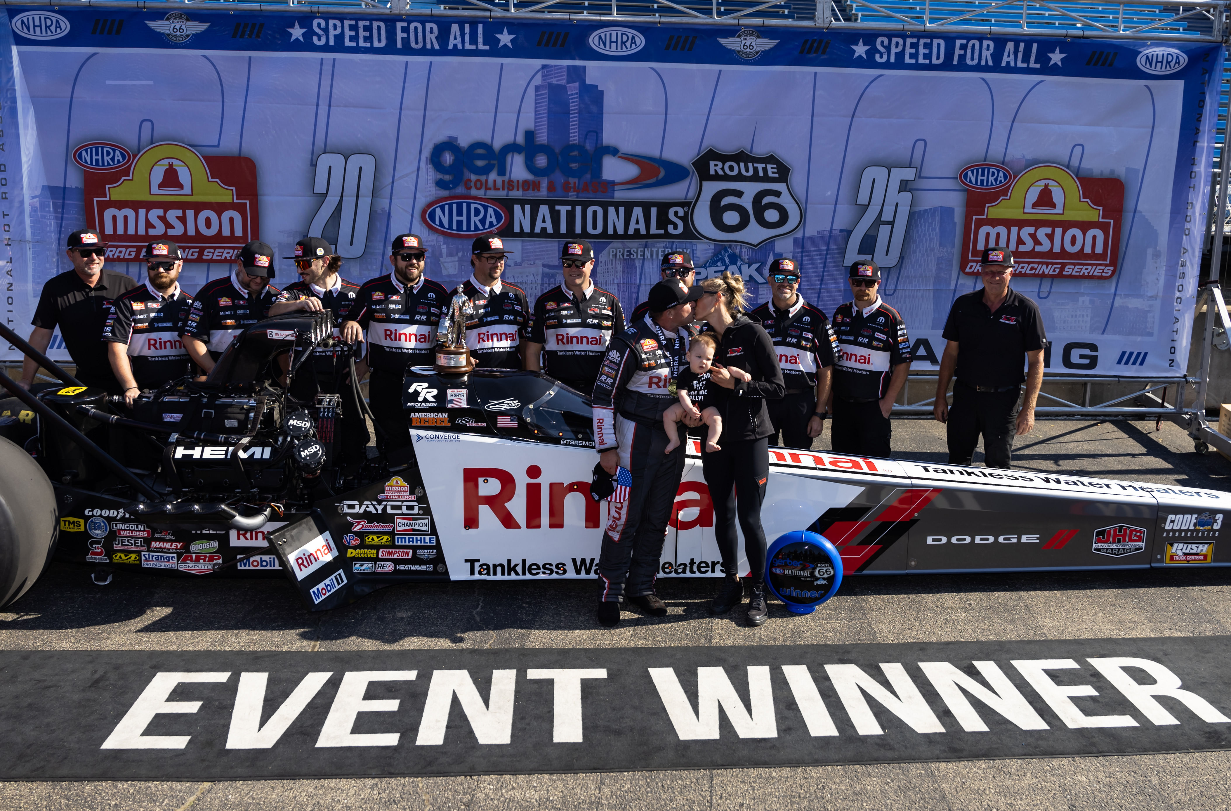 Tony Stewart celebrates with wife Leah Pruett, son Dominic Stewart, and crew after winning the Route 66 Nationals at Route 66 Raceway. - Source: Imagn